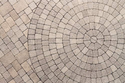 Paver Bricks Arranged In A Circular Pattern Of Concentric Geometric